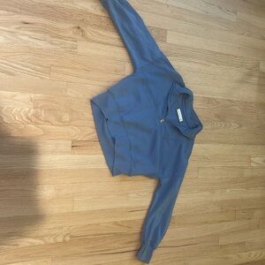 Grey-ish blue sweater.